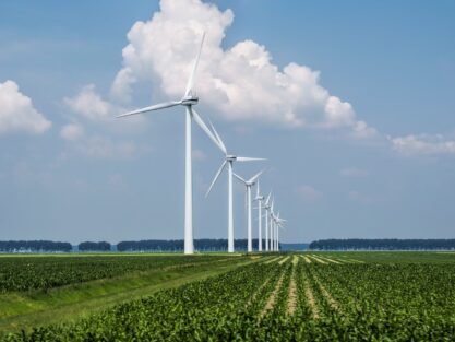 beautiful-view-wind-turbines-grass-covered-field-captured-holland_181624-6013