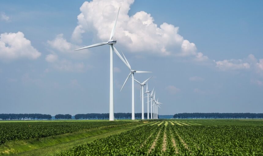 beautiful-view-wind-turbines-grass-covered-field-captured-holland_181624-6013