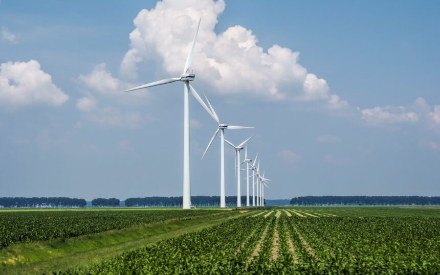 beautiful-view-wind-turbines-grass-covered-field-captured-holland_181624-6013